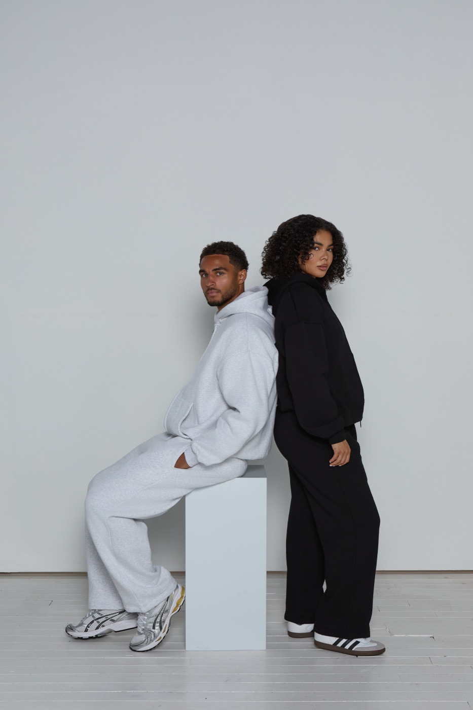 Kyle Jameson and a model wearing Lui e Lei loungewear, back to back